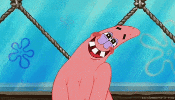 Patrick smiling and blushing and shaking his head back and forth