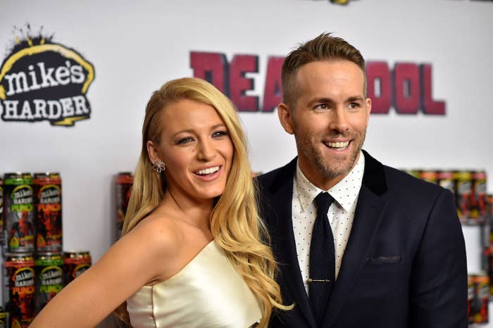 Blake Lively and Ryan Reynolds posing at the Deadpool premiere