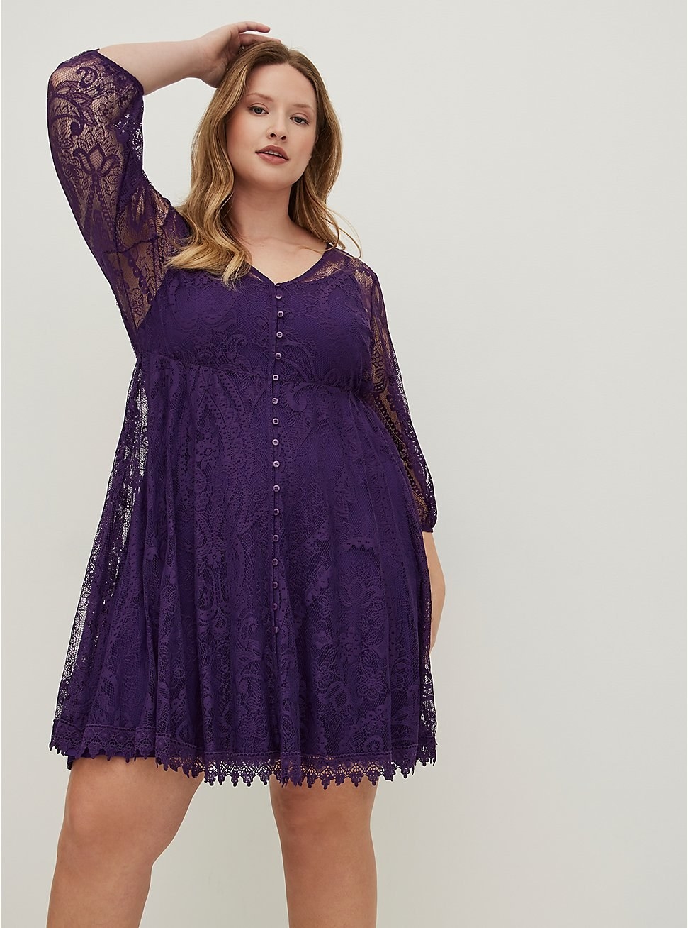 Model wearing purple lace skater dress