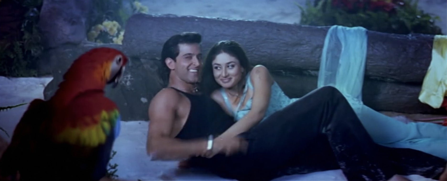 Hrithik and Kareena laughing while the CGI parrot looks at them