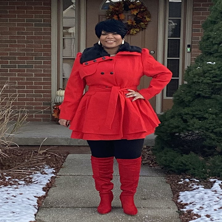 a reviewer in the coat in red