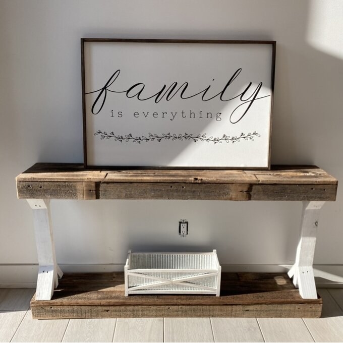 A reviewer&#x27;s image of a solid wood console table