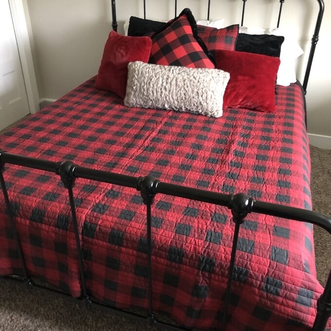 A reviewer&#x27;s image of a farmhouse-style platform bed