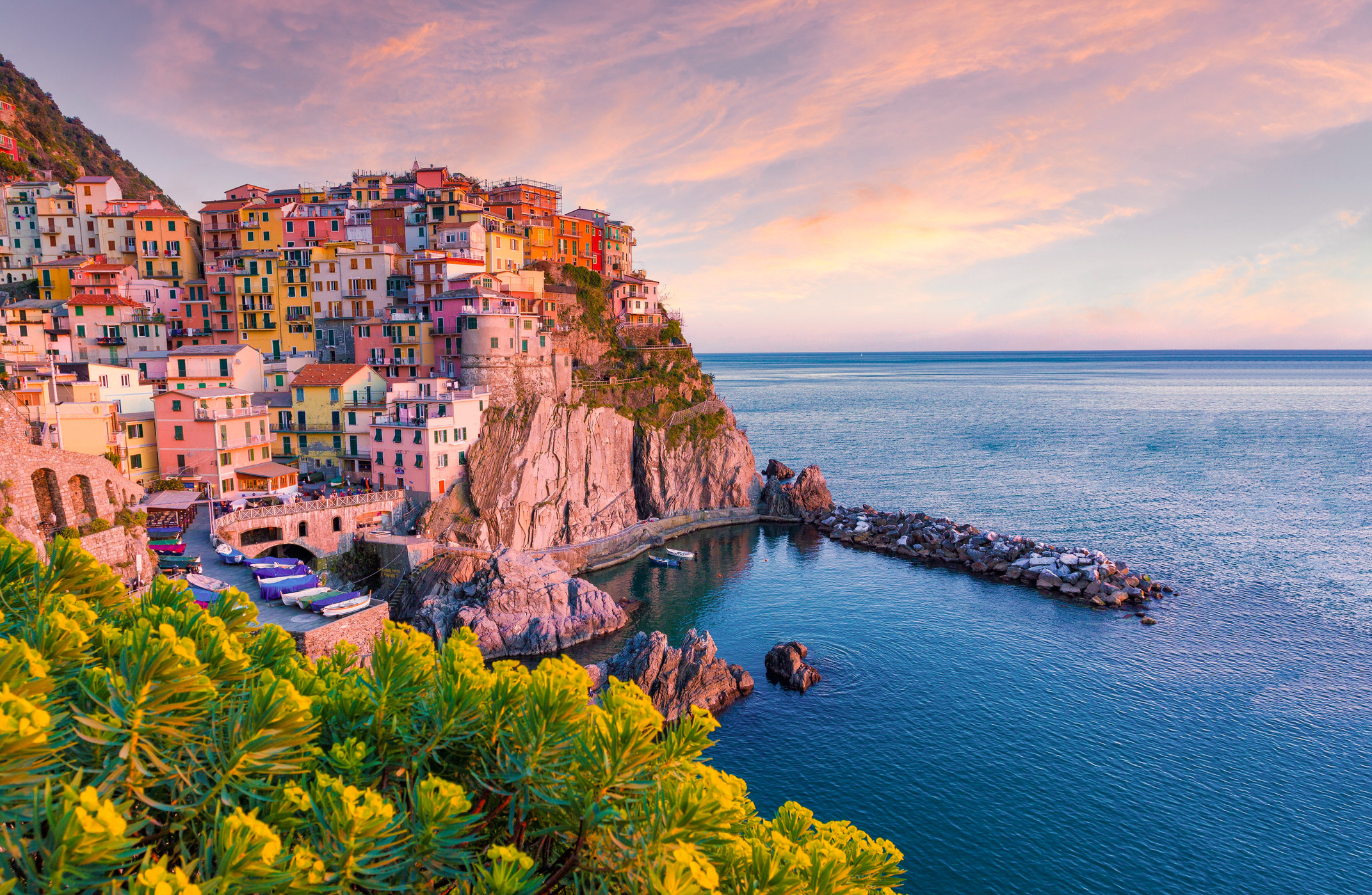 Sunset over Manarola, Cinque Terre, Liguria, Italy from an oceanside vantage point