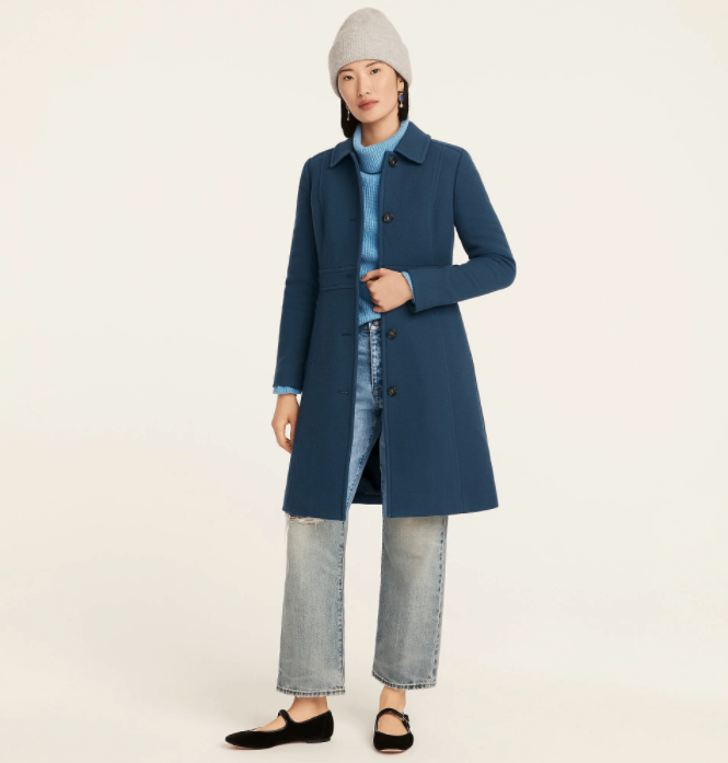 a model in the wool coat in blue