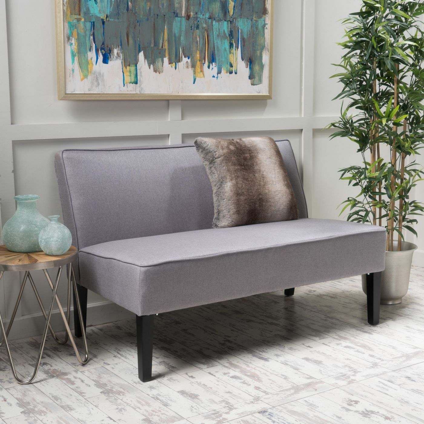 the grey bench in a decorated living room