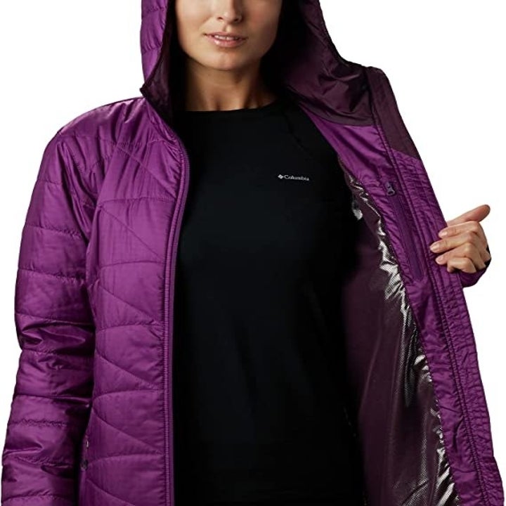 another model in the coat in purple