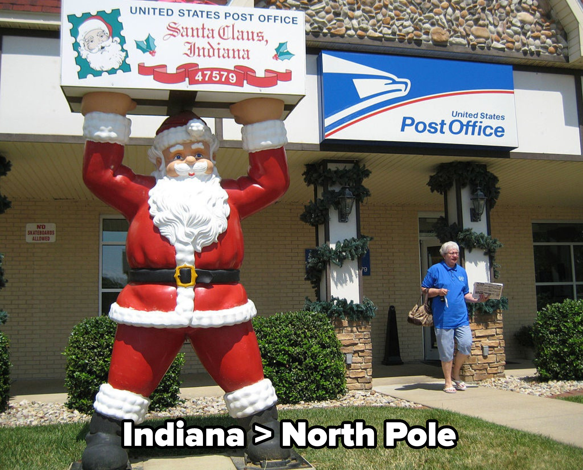 the post office at Santa Claus, with a giant statue of Santa out the front, with caption: Indiana &amp;gt; North Pole