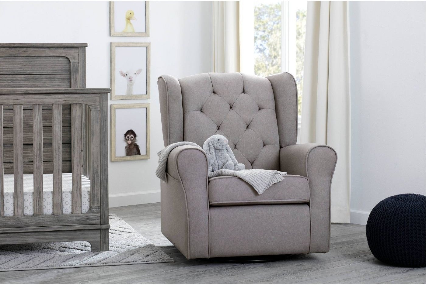 the grey armchair in a grey decorated nursery