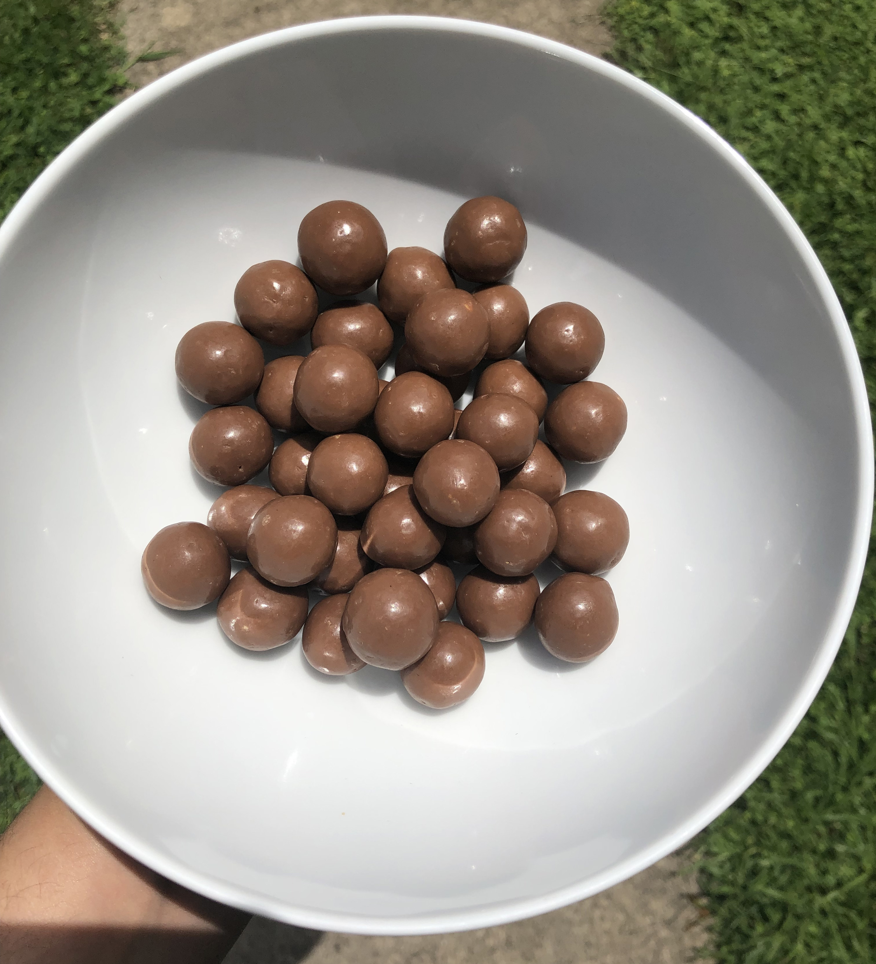 A close up of the popcorn flavour Maltesers in a bowl