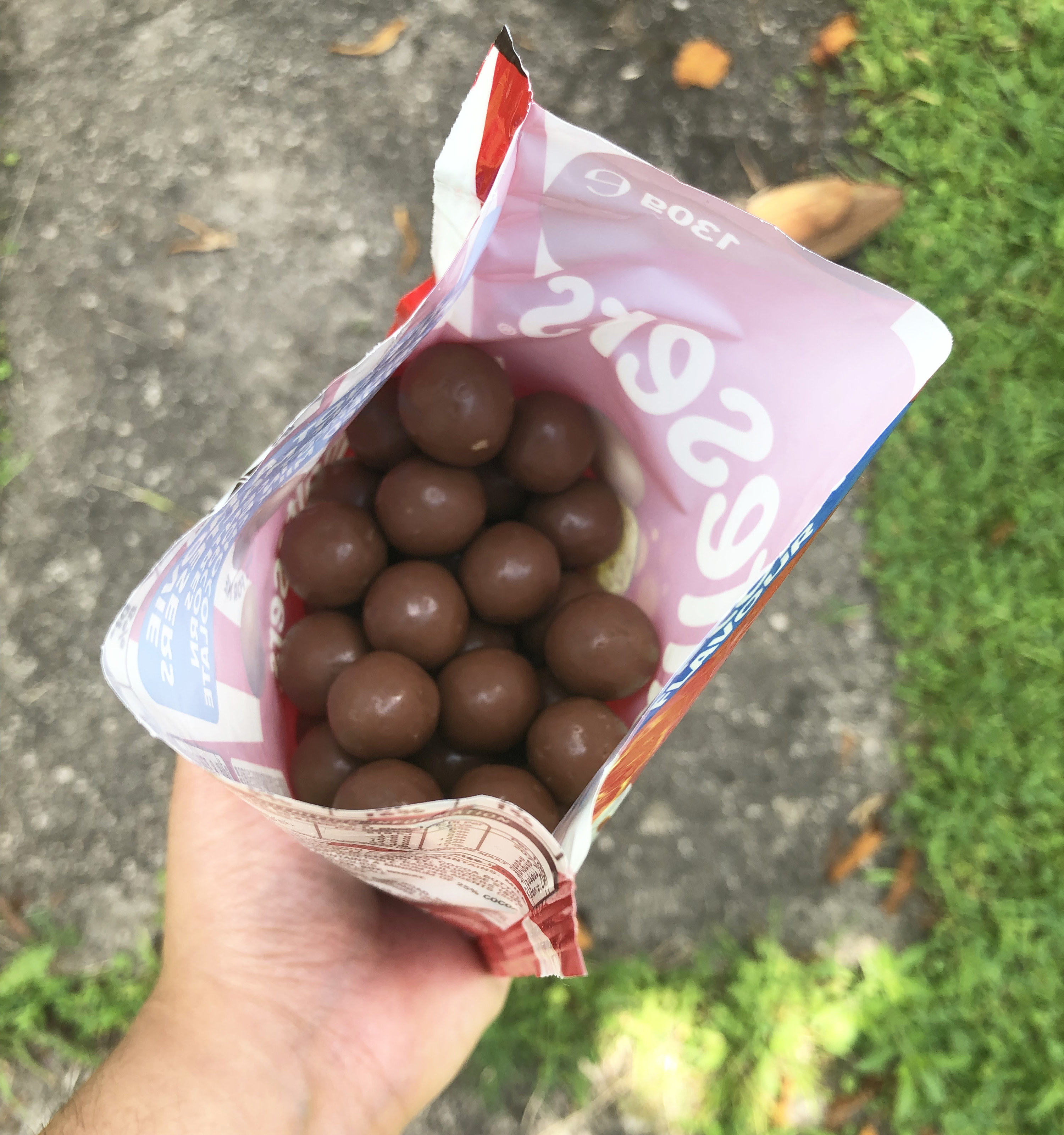 A close up look at the inside of the popcorn flavour Maltesers in their bag