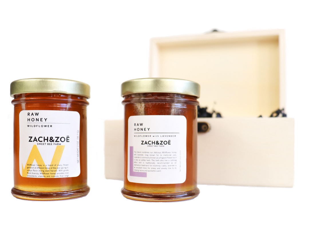 the honey sampler featuring two jars of raw honey and their wooden gift box
