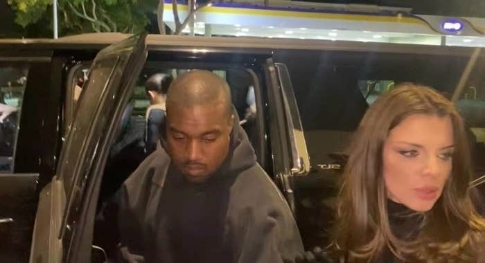 Kanye West and Julia Fox exit a car