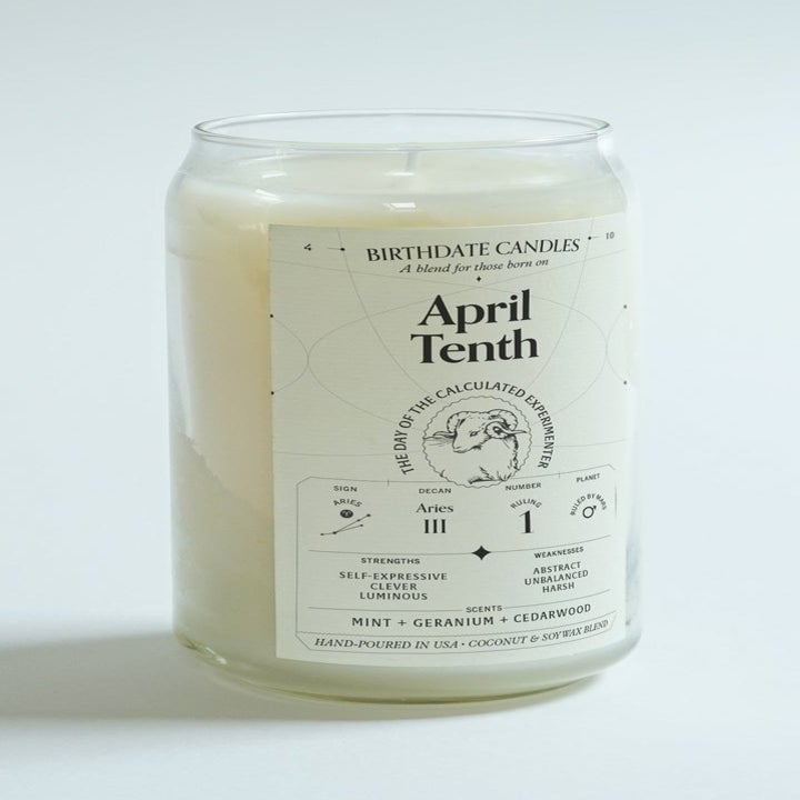 a tall candle with a label that says "april tenth"