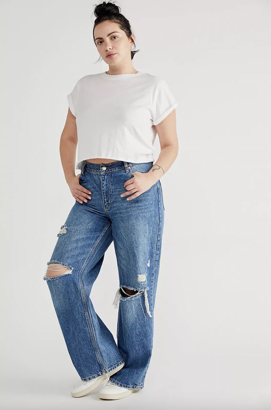 Model wearing blue jeans