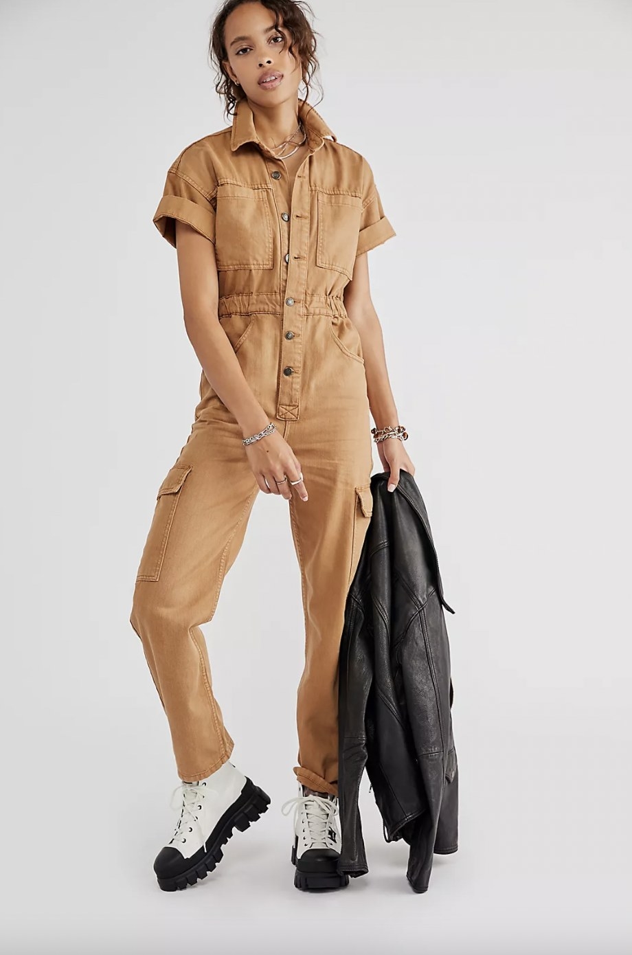 Model wearing tan coverall