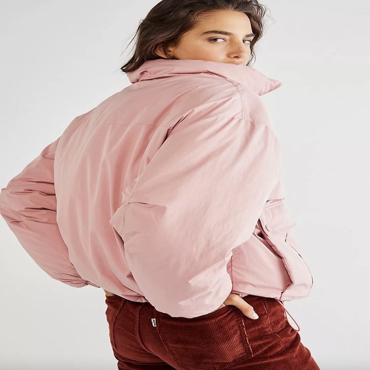 Model wearing pink duvet jacket