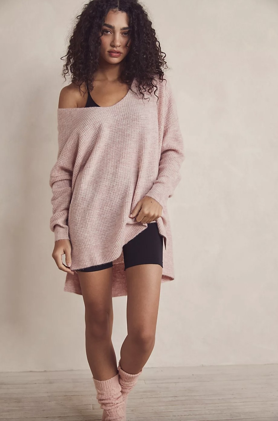 Model wearing pink oversized sweater