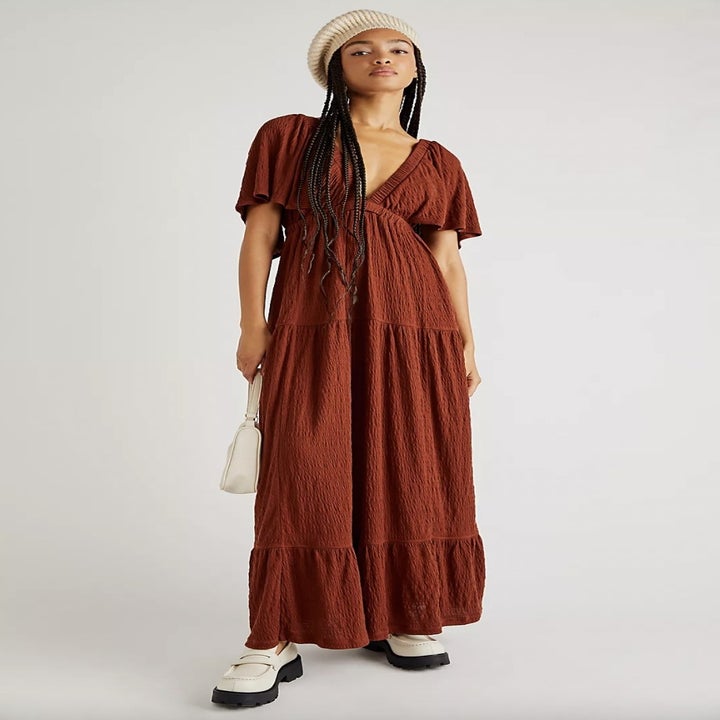 Model wearing burgundy maxi dress