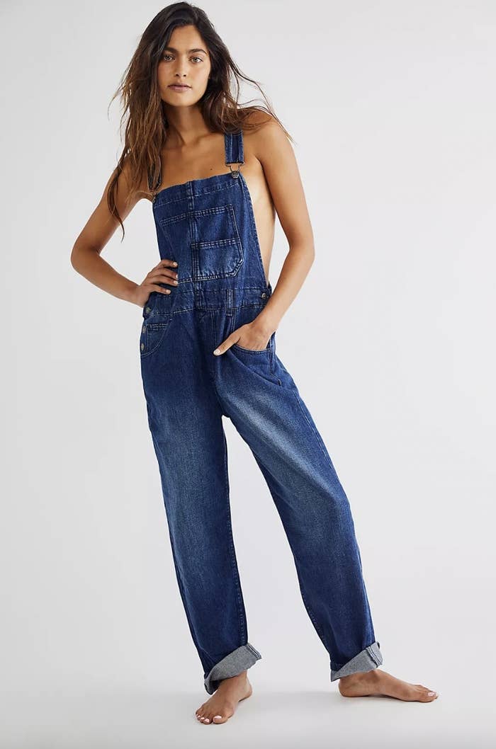 Model wearing blue jean overalls
