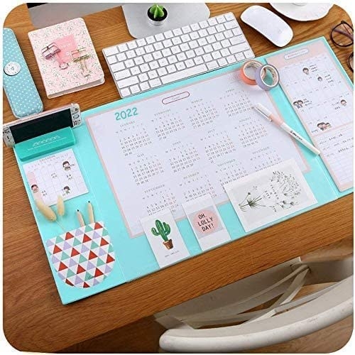 the turquoise mouse pad with a 2022 calendar on it