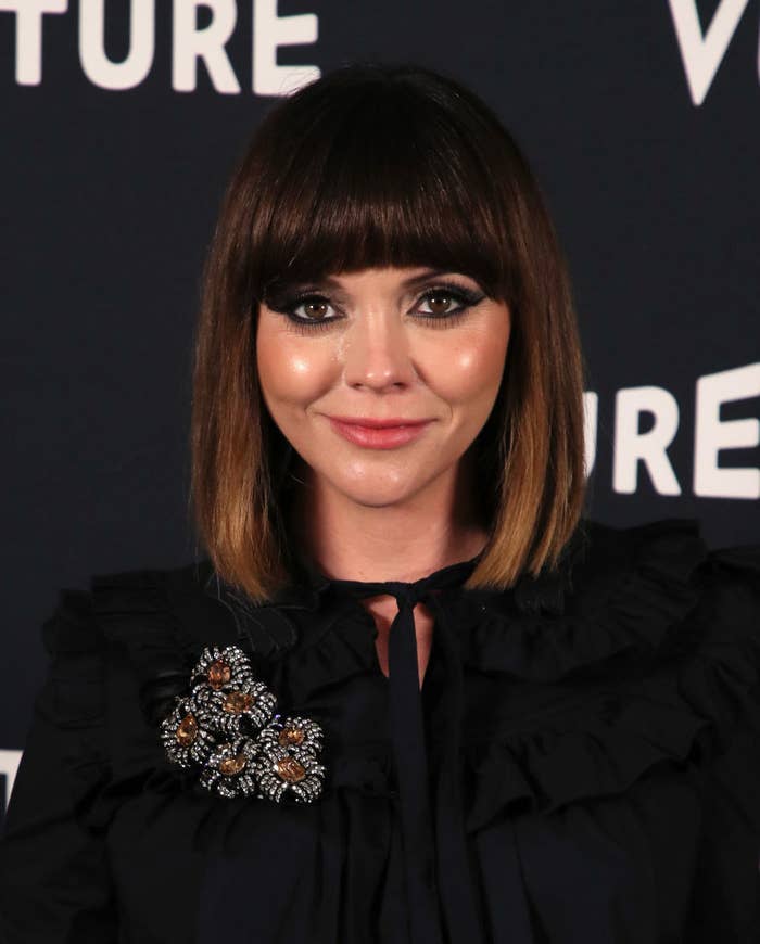 Christina at a red carpet event rocking a blunt bob cut with bangs