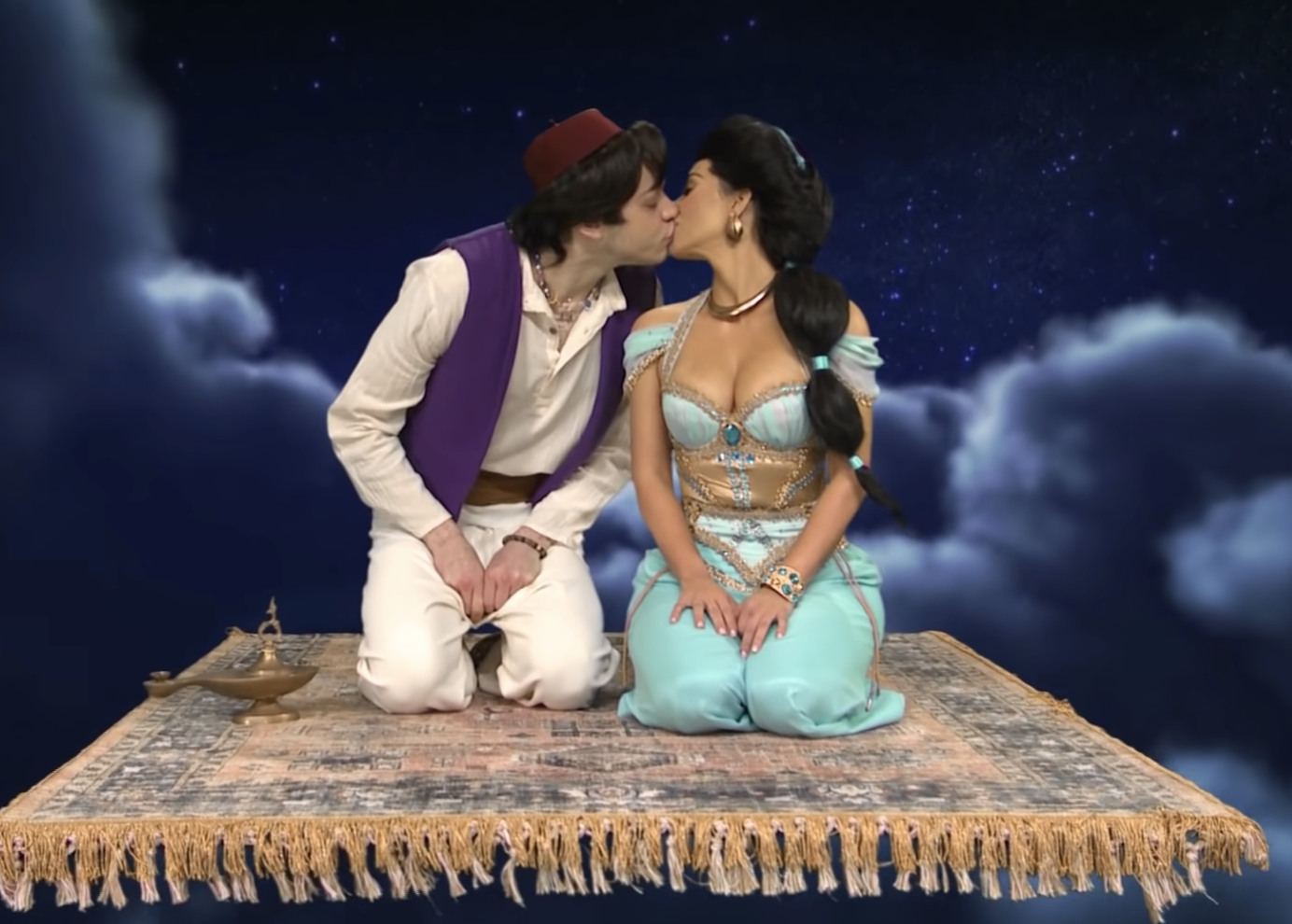 Pete and Kim kissing during a SNL sketch where they portrayed Aladdin and Princess Jasmine