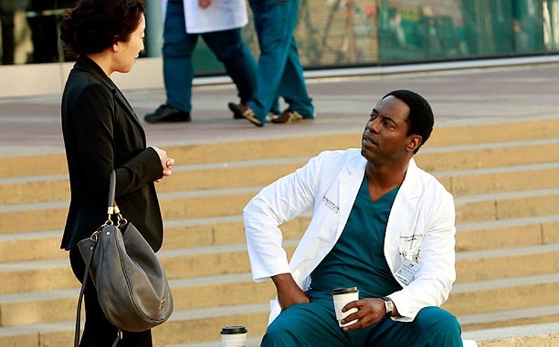 Cristina Yang talking to Dr Burke on the steps of a hospital