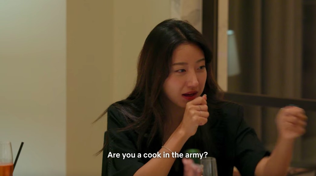 Yea-won holds out her hand as a microphone to Jun-sik and asks &quot;are you a cook in the army?&quot;