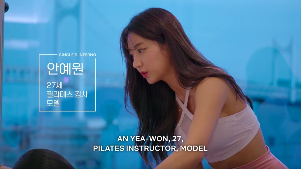 Yea-won helps a client with Pilates