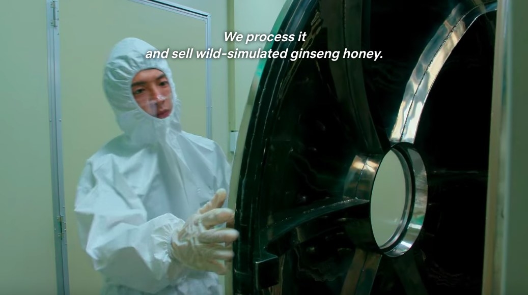 Jun-sik wears a beekeeper-type suit in a facility that processes honey