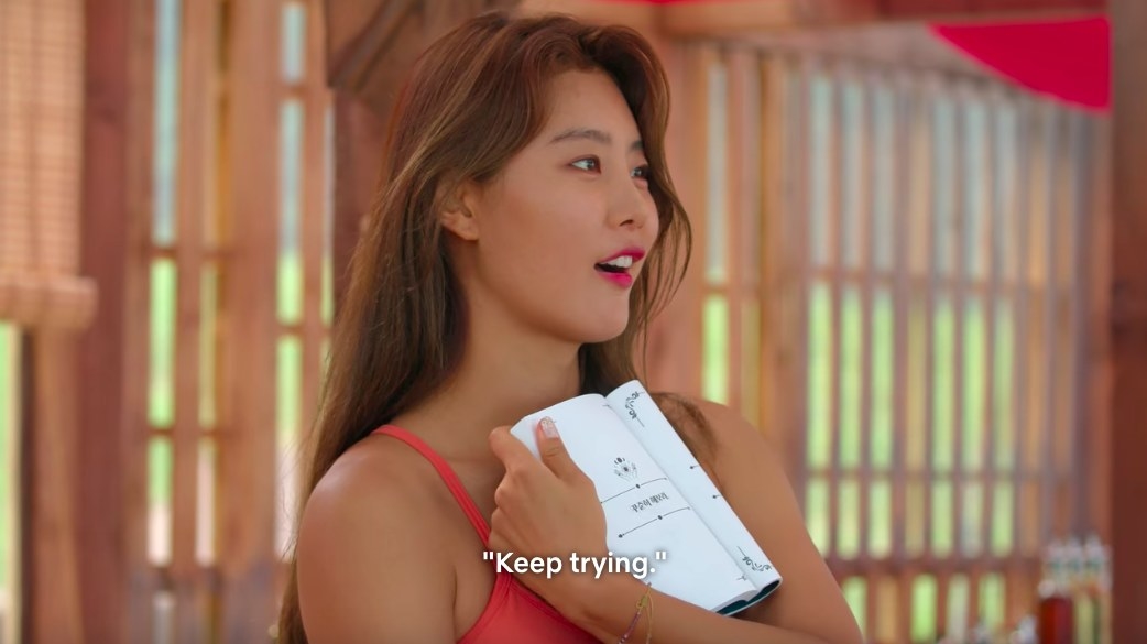 So-yeon opens the book to a page that reads &quot;Keep trying,&quot; and gasps