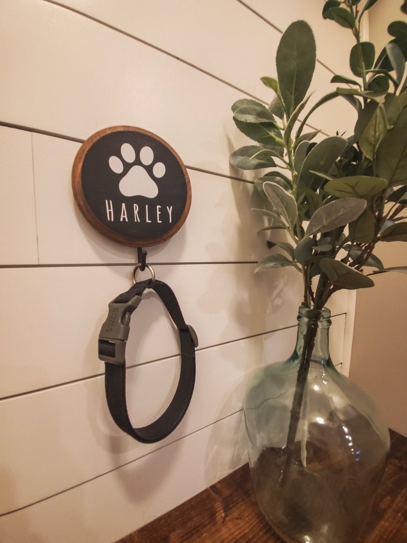 a photo of the custom leash holder hanging on the wall