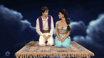 Pete and Kim kissing during a SNL sketch where they play Aladdin and Jasmine