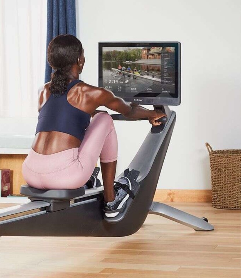 Monitor using Hydrow rower watching rowing on its screen