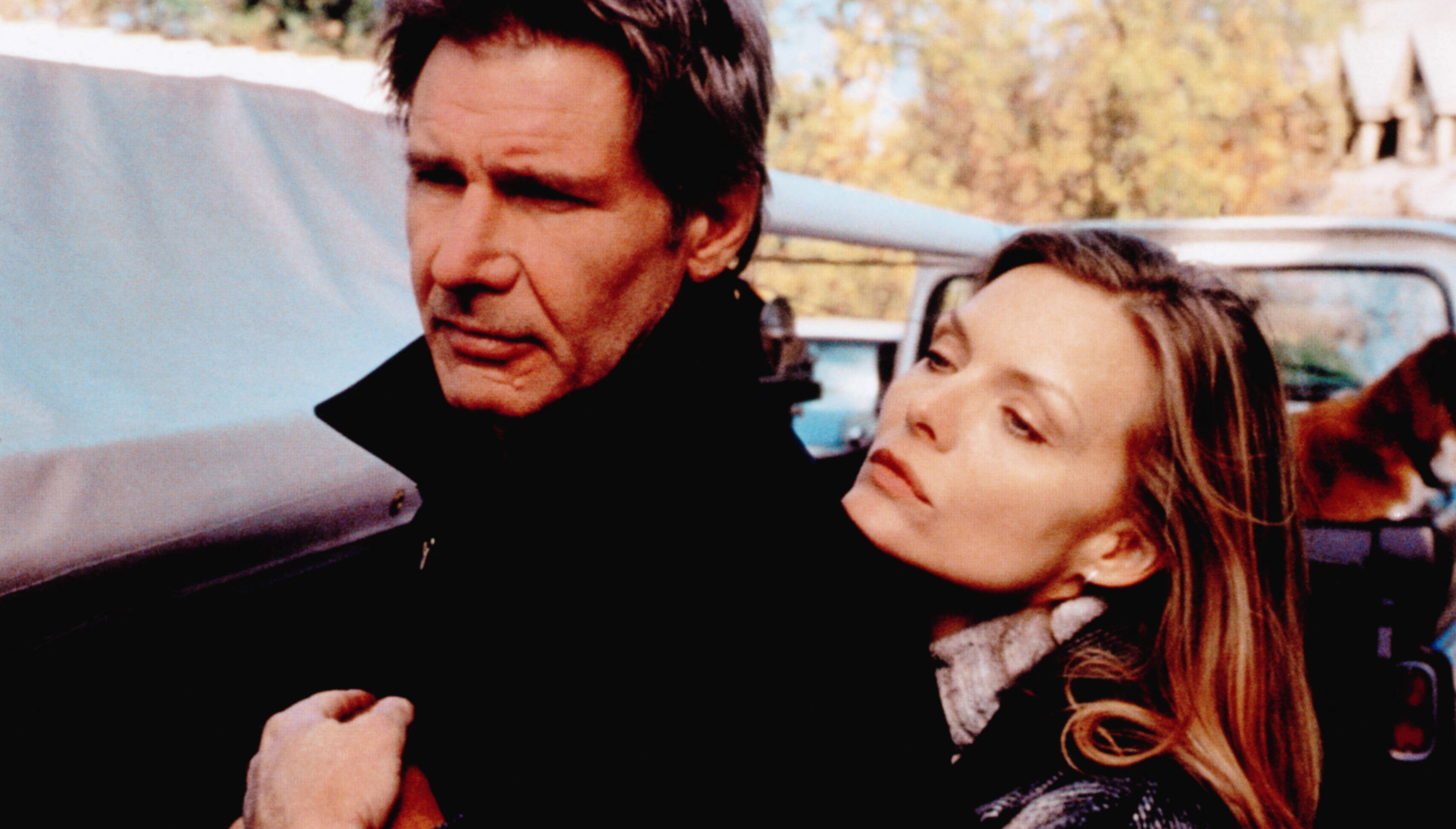 Michelle Pfeiffer holding on to Harrison Ford