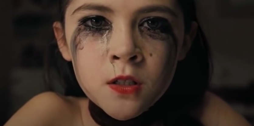 Isabelle Fuhrman with mascara running down her face