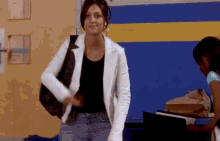 Paige holding Darcy during Spirit Squad practice on Degrassi