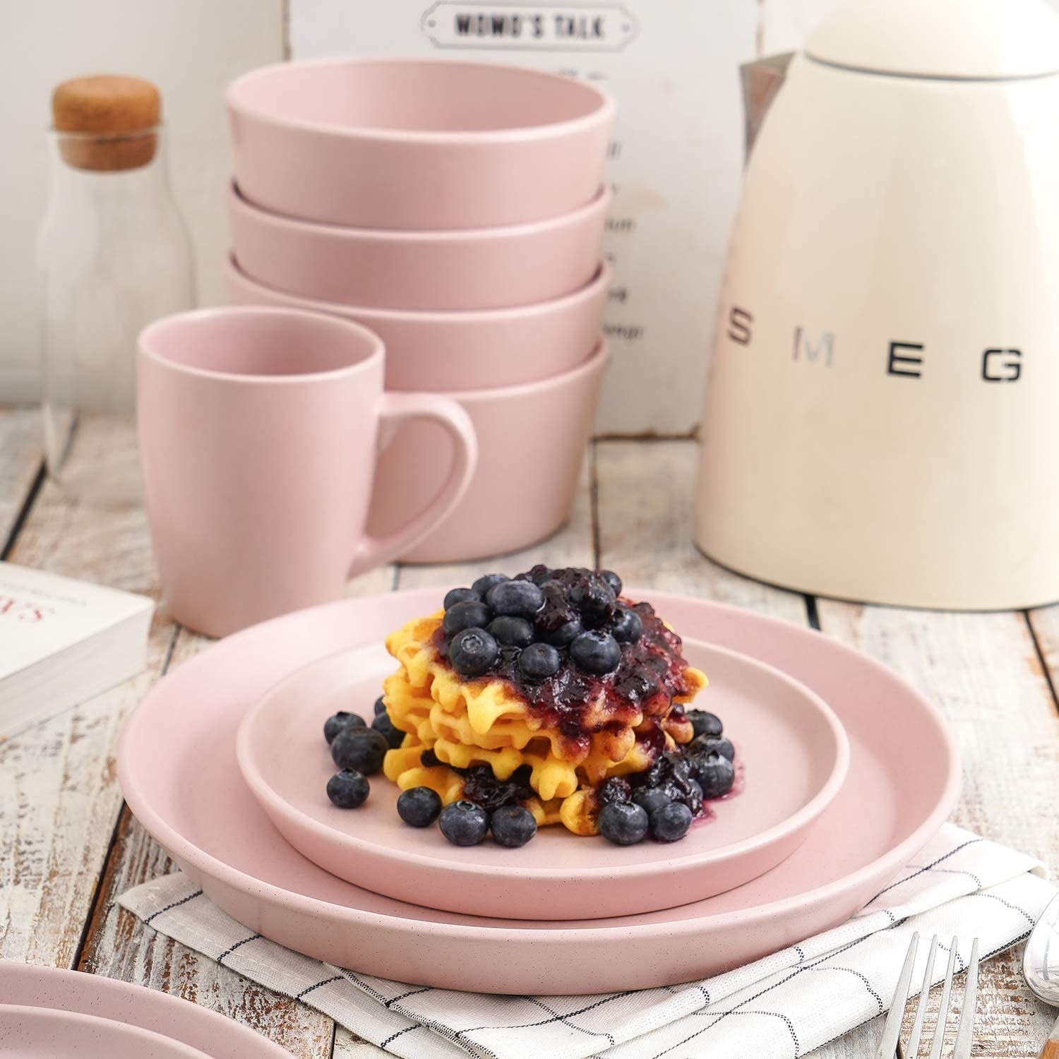 a stoneware dinnerware set on a country style table