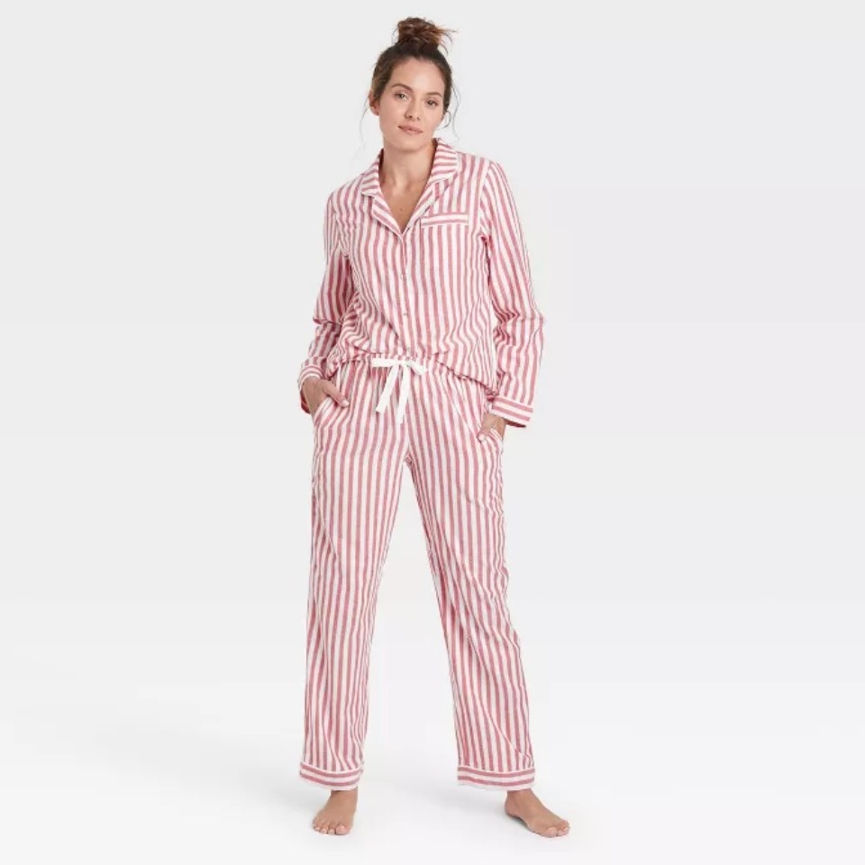 a model wearing the pink and white striped flannel pj set