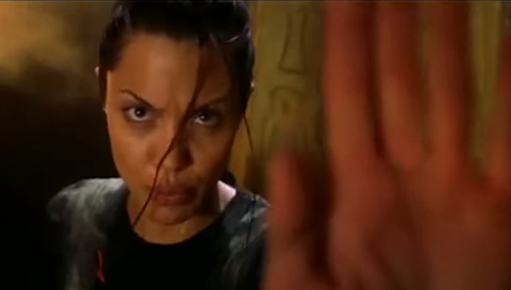 Angelina Jolies Lara Croft telling someone or something to stop