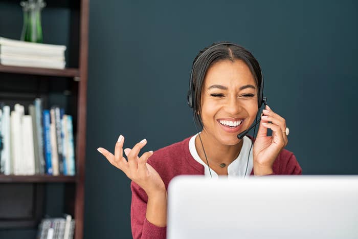 Woman with a headset on talks on the phone