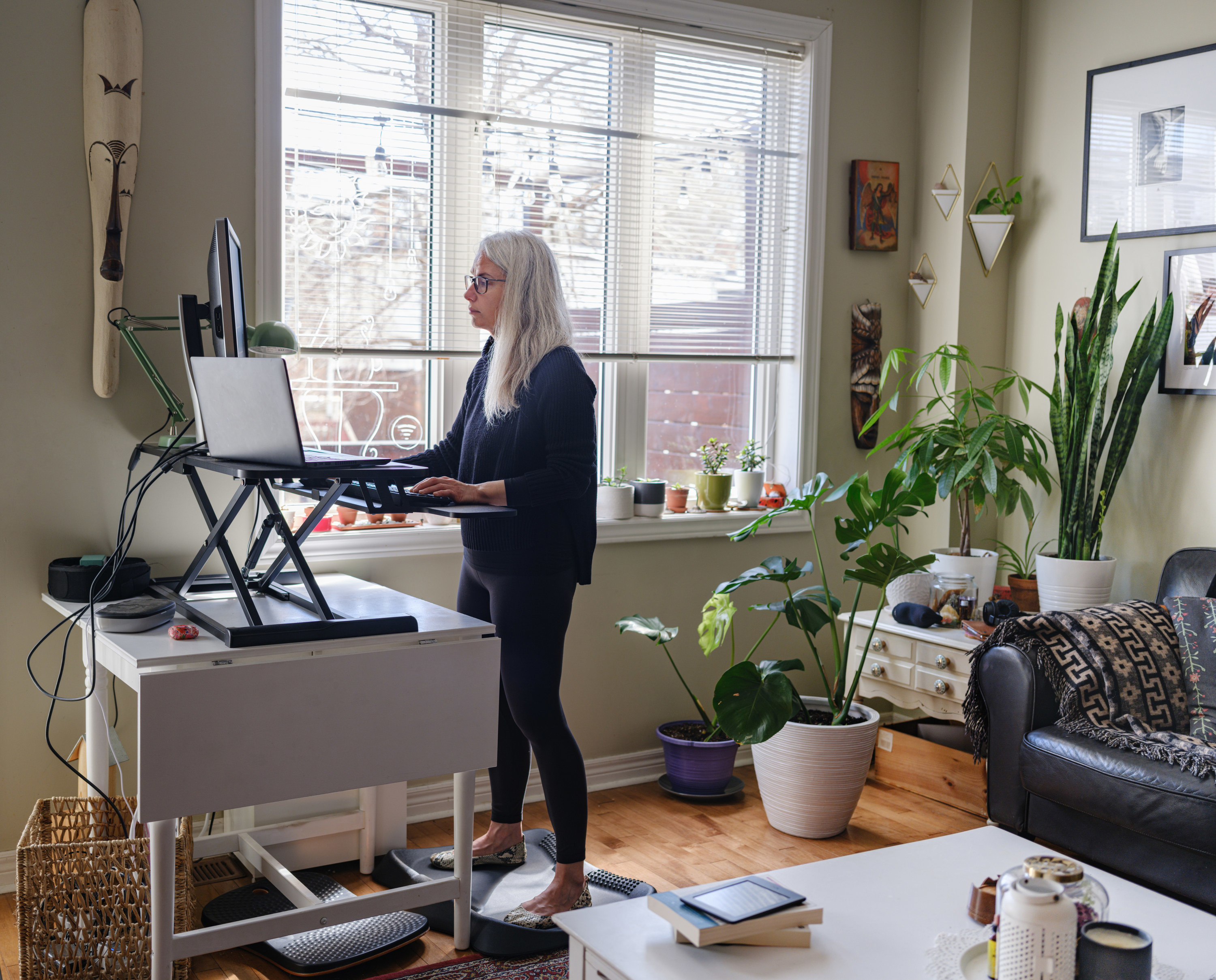 Woman working from a standing desk at home