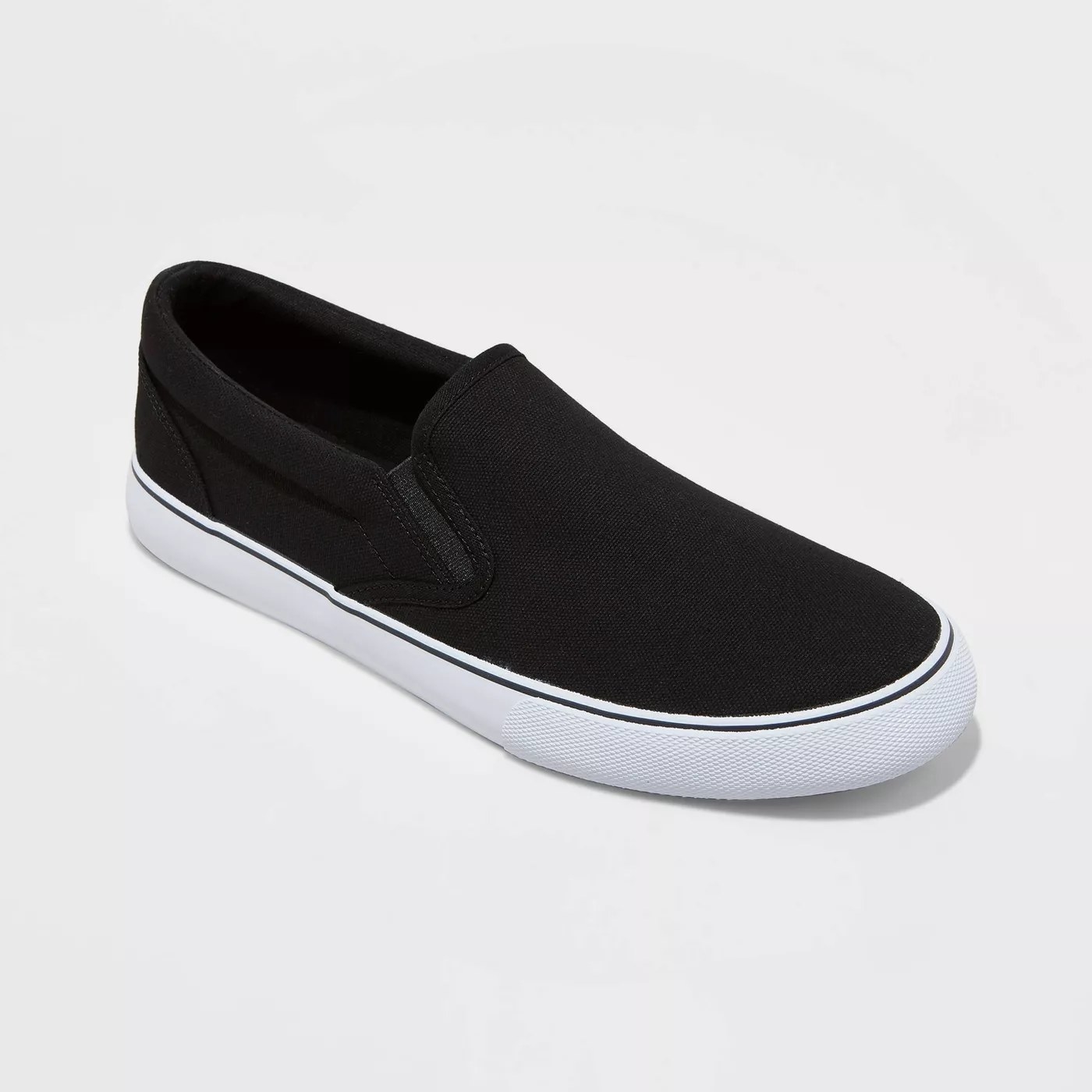 A black slip-on sneaker with a white outsole
