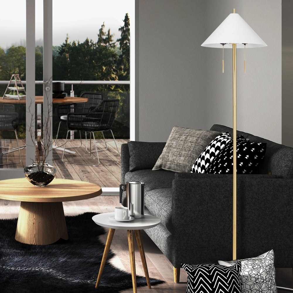 The metal floor lamp next to a couch