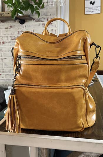 the backpack in a golden brown color