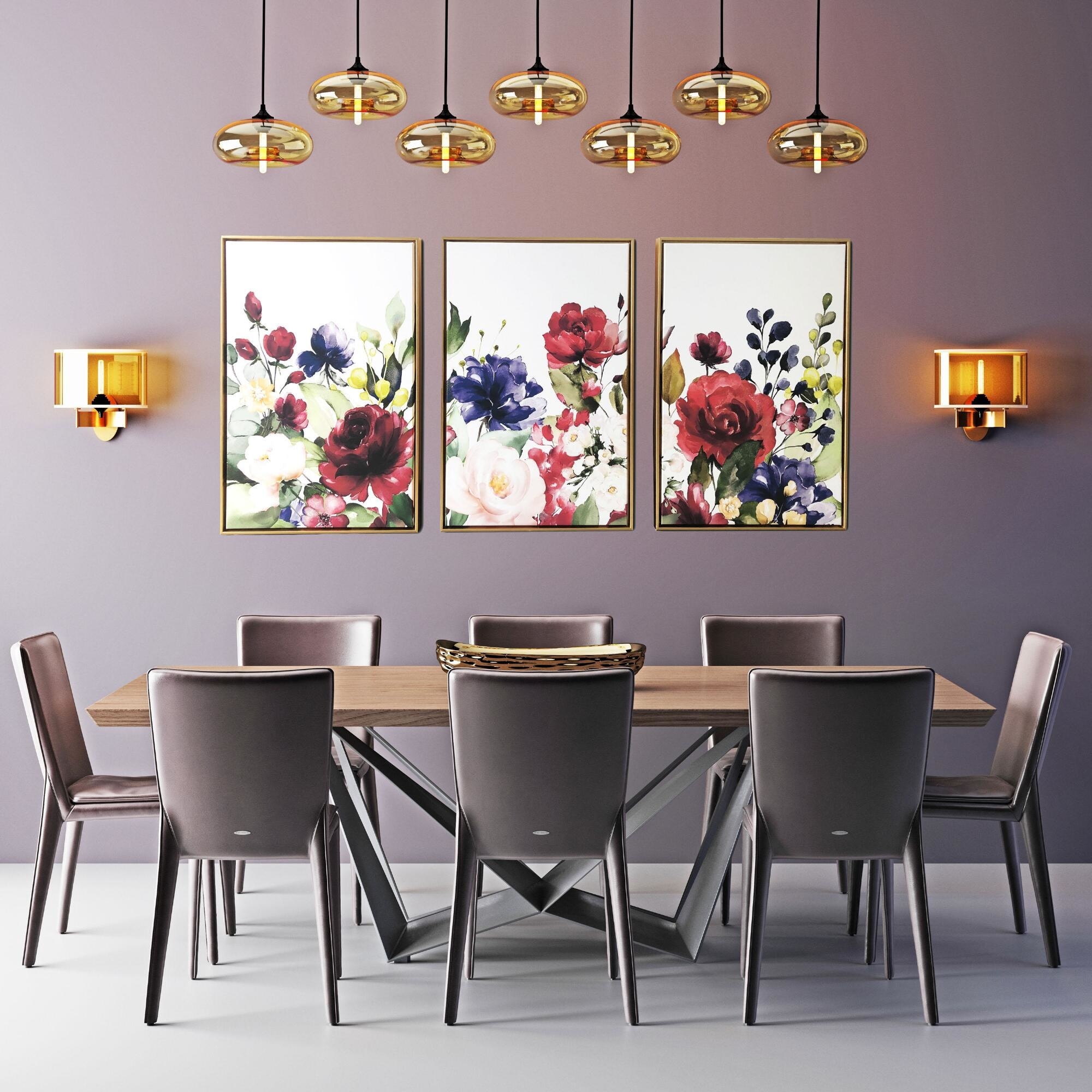 The floral three-piece set hanging on wall by dining room table