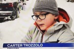 A kid surrounded by snow talking to a news reporter.