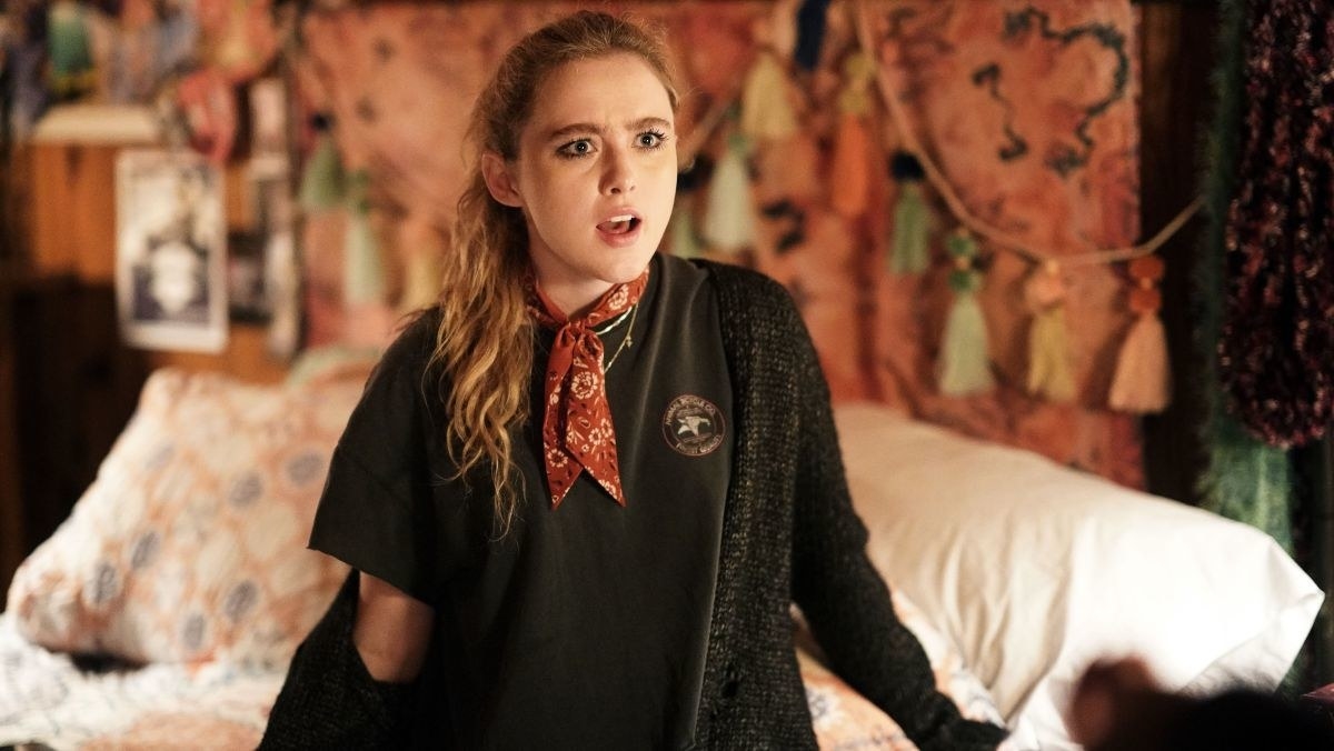 Kathryn Newton sits on a bed in Big Little Lies
