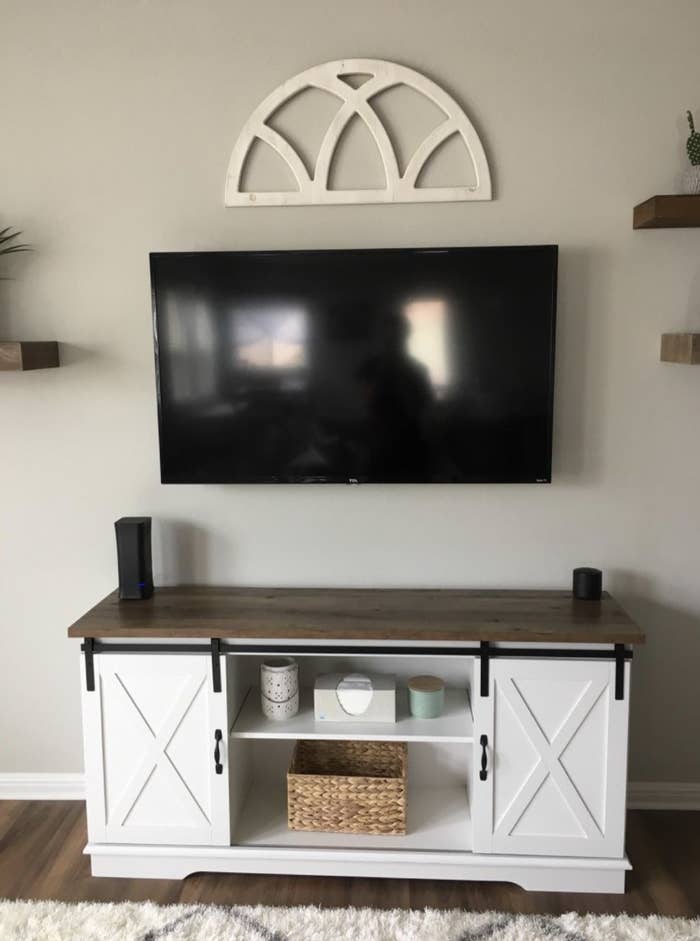 Reviewer&#x27;s photo of the white tv stand